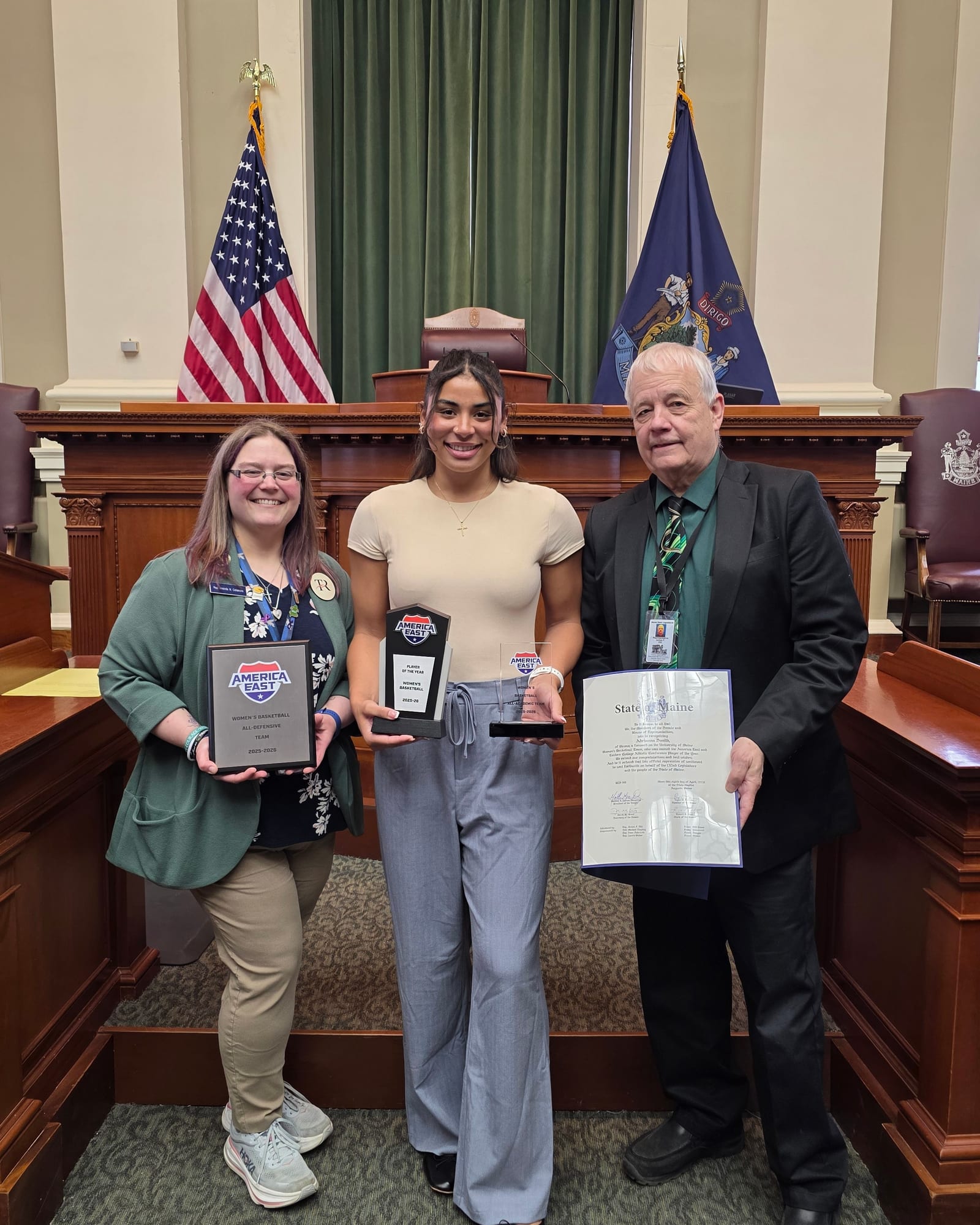 Rep. Collamore honoring the University of Maine women's basketball Player of the Year in the House chamber